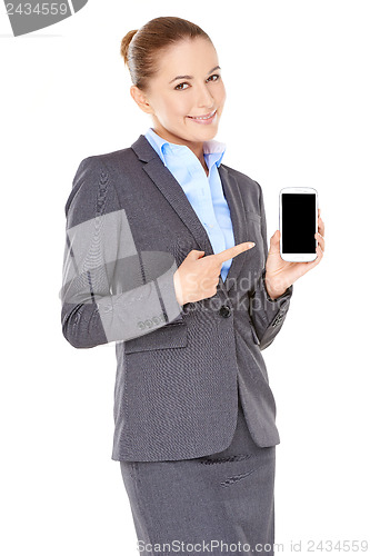Image of Smiling businesswoman pointing to her mobile