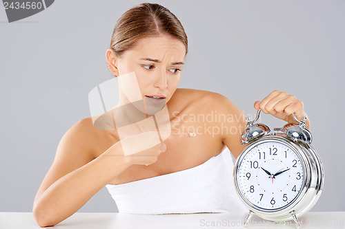 Image of Bored young woman counting down the time