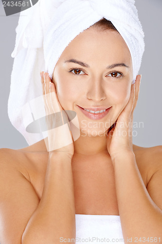 Image of Beautiful woman with her hair in a towel