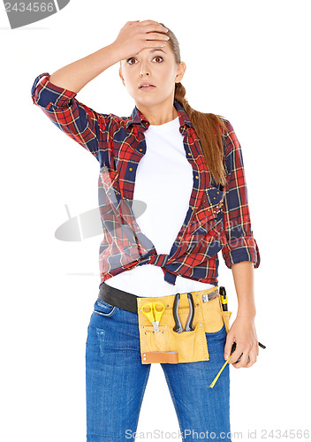 Image of DIY handy woman with a dazed expression