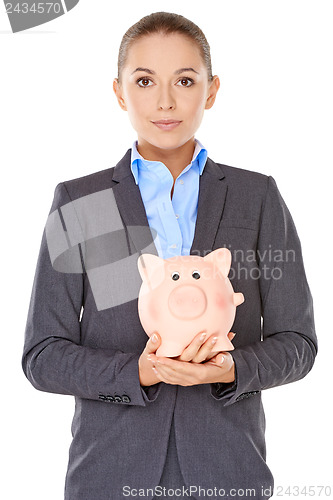 Image of Businesswoman holding a piggy bank