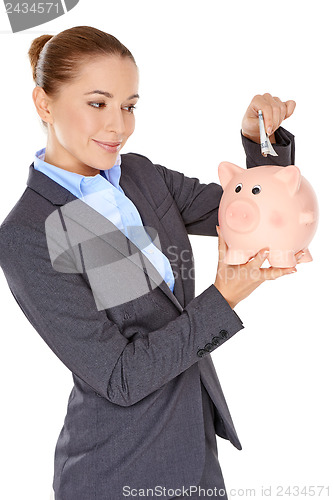 Image of Successful businesswoman with a piggy bank