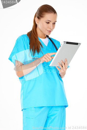 Image of Doctor checking information on a tablet