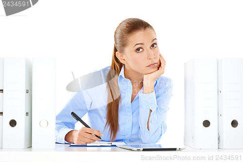 Image of Overworked stressed businesswoman