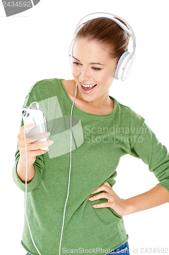 Image of Woman laughing as she enjoys her music