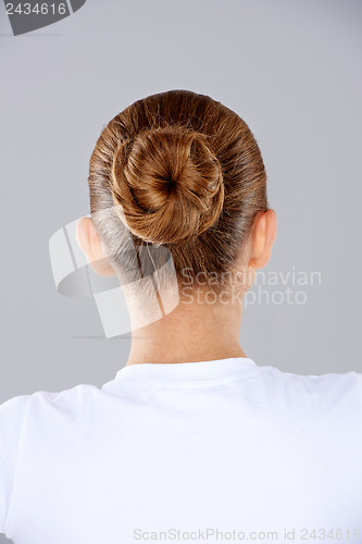 Image of Brunette hair in a neat bun