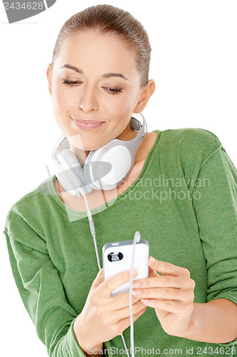Image of Woman searching her downloaded audio files