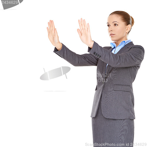 Image of Businesswoman pointing and looking up
