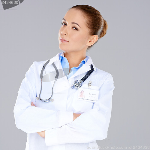 Image of Confident female doctor with crossed arms