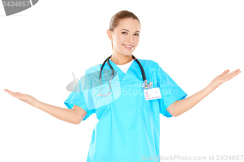 Image of Smiling woman doctor raising her hands