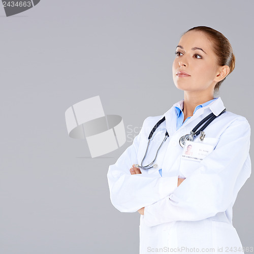 Image of Confident female doctor with crossed arms