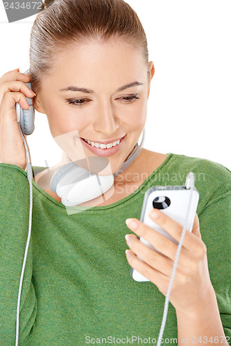 Image of Woman listening to a new music download
