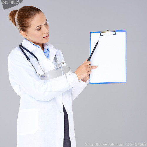 Image of Female doctor or nurse with a clipboard