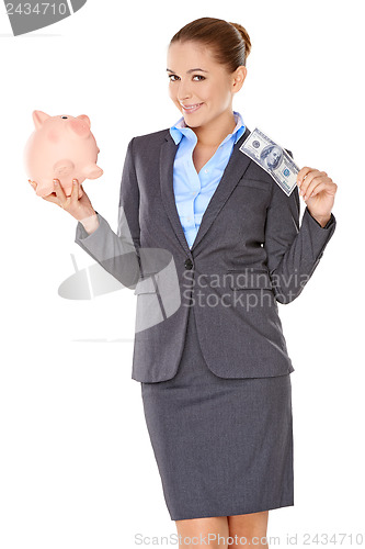 Image of Successful businesswoman with a piggy bank