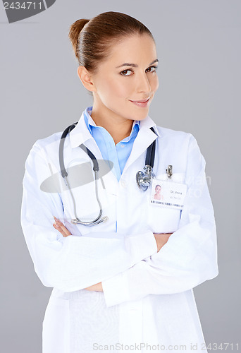 Image of Confident female doctor with crossed arms