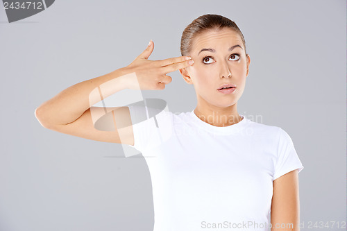 Image of Woman making a handgun gesture