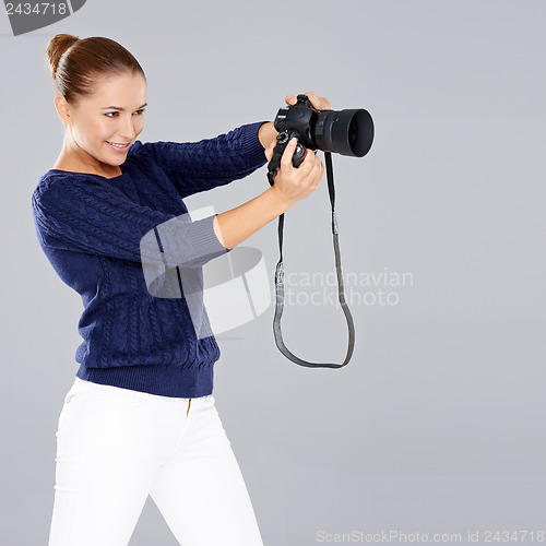 Image of Pretty vivacious young female phoptographer