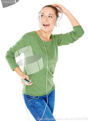 Image of Blissful woman dancing and listening to music