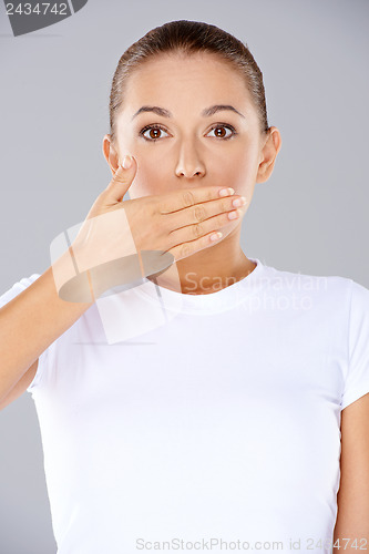 Image of Shocked woman with her hand to her mouth