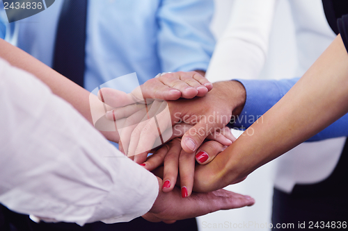 Image of business people group joining hands