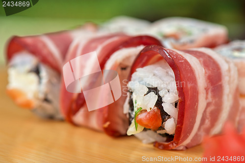 Image of Sushi roll with bacon