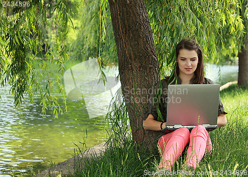 Image of Young Woman Studying Outside