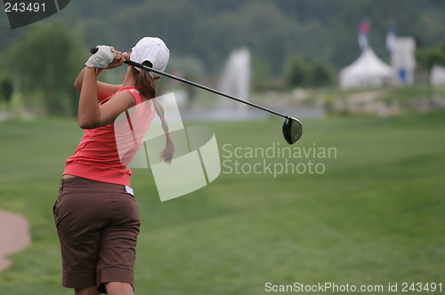 Image of lady golf swing