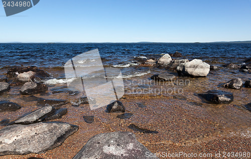 Image of Large gray rocks on the shore of Lake