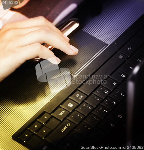 Image of Young woman with laptop 