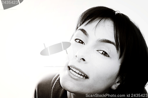 Image of Young woman in bed