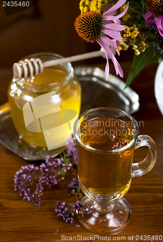 Image of Still life from medicinal herbs, honey, herbal tea