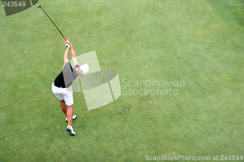 Image of lady golf swing