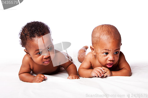 Image of Two adorable babies laying together