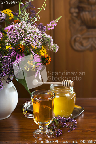 Image of Still life from medicinal herbs, honey, herbal tea