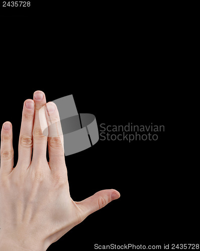 Image of White hand on black