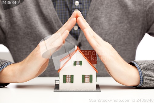 Image of Hands as a protecting roof