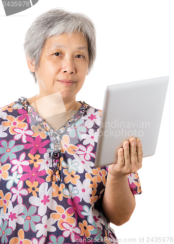Image of Asian old woman with digital tablet