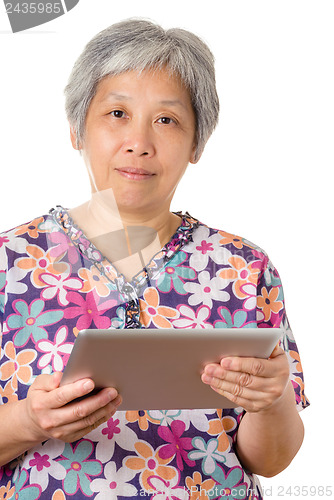 Image of Asian elderly with digital tablet