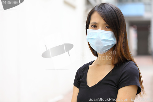 Image of Asian woman wear protective face mask