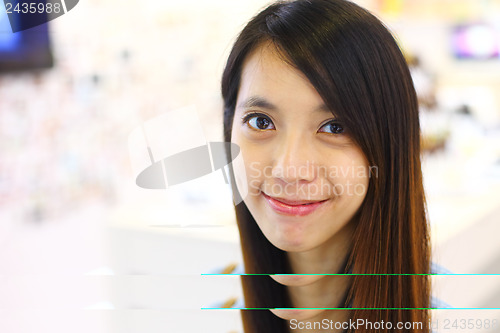 Image of young woman smiling friendly
