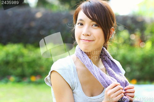 Image of Asian woman doing exercise