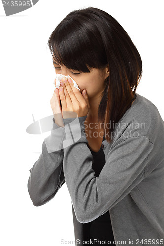 Image of Cold sneezing asian woman