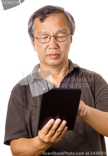 Image of Asian old man using tablet