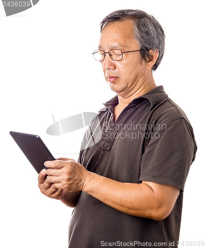 Image of Asian man using tablet