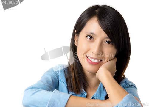 Image of Asian woman with smile lying on table
