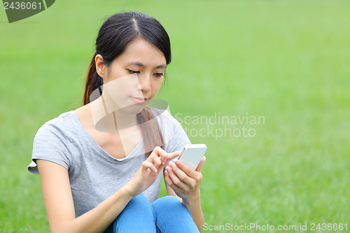 Image of Asian woman using mobile