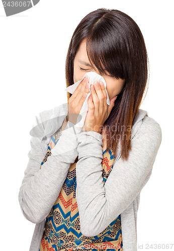 Image of Cold sneezing asian woman