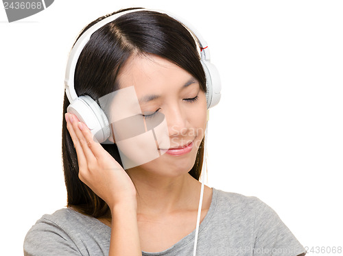 Image of Asian woman listen to music