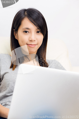 Image of Asian woman using laptop