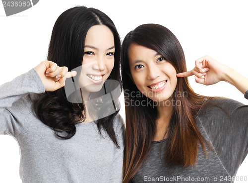 Image of Two asian woman friend smile